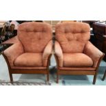 A pair of Ercol elm and beech framed armchairs with terracotta upholstered cushions, 100cm high x
