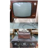 A mid 20th century Ekco television, 84cm high x 68cm wide x 36cm deep, leather travel case and a