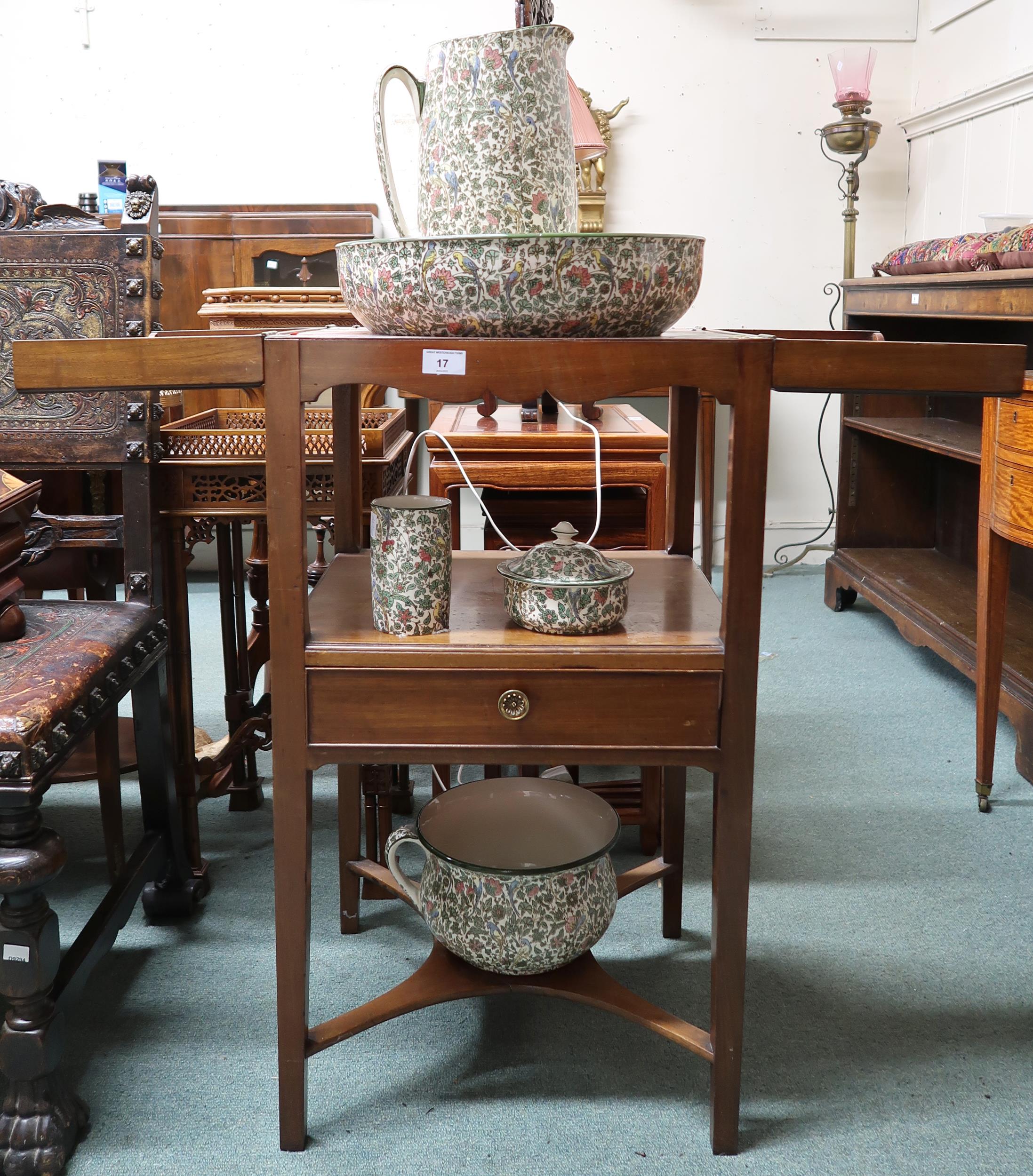 A 19th century mahogany wash stand with twin hinged top over single drawer on square tapering