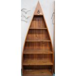 A 20th century outback furniture graduating open bookcase in the form of a row boat, 205cm high x