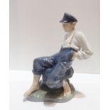 A Royal Copenhagen figure of a boy with a fishing rod, no. 1659 Condition Report:Available upon