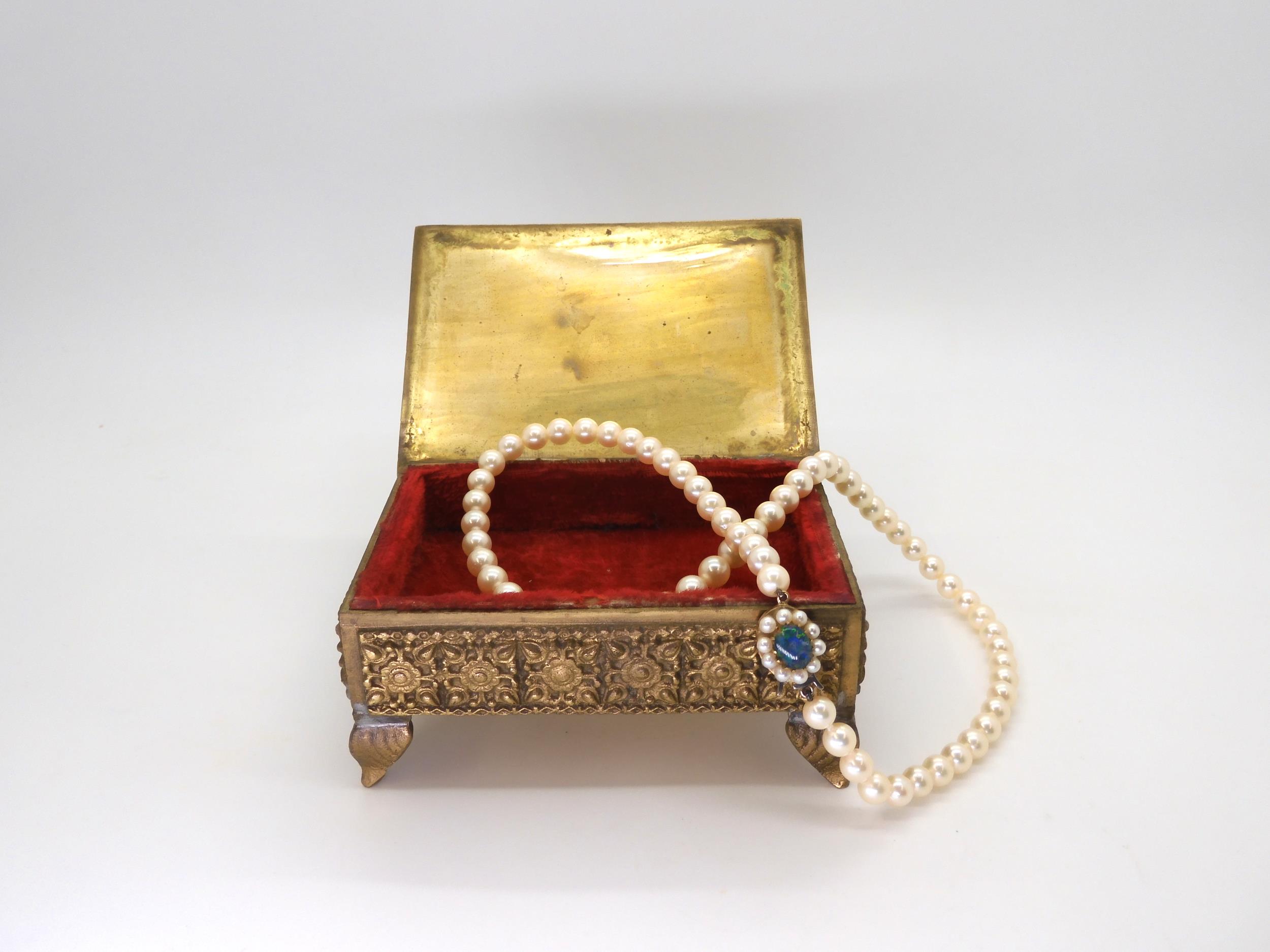 A string of pearls with a 9ct gold opal doublet and pearl set clasp, length 43.5cm, pearls all