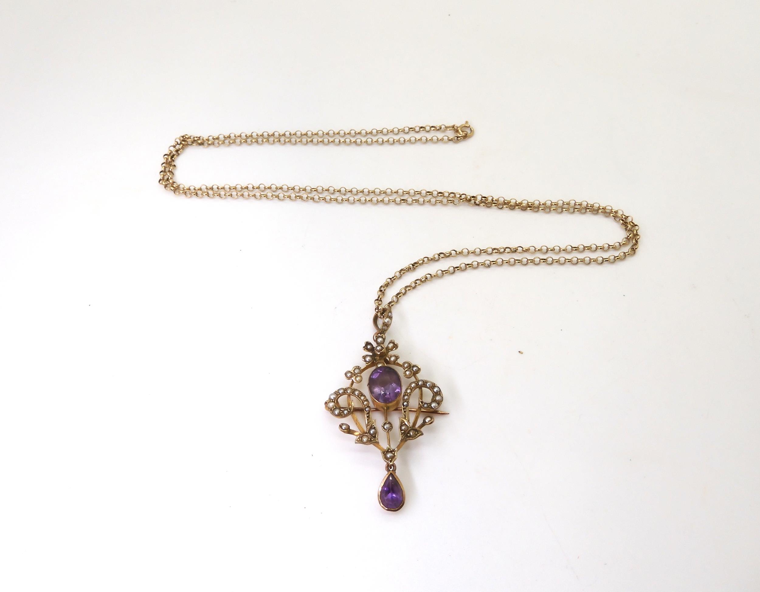 A 9ct gold Edwardian amethyst and pearl pendant brooch on a long 66cm 9ct gold belcher chain, weight