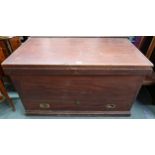 A large Victorian pine blanket chest with hinged top concealing internal candle store with two short