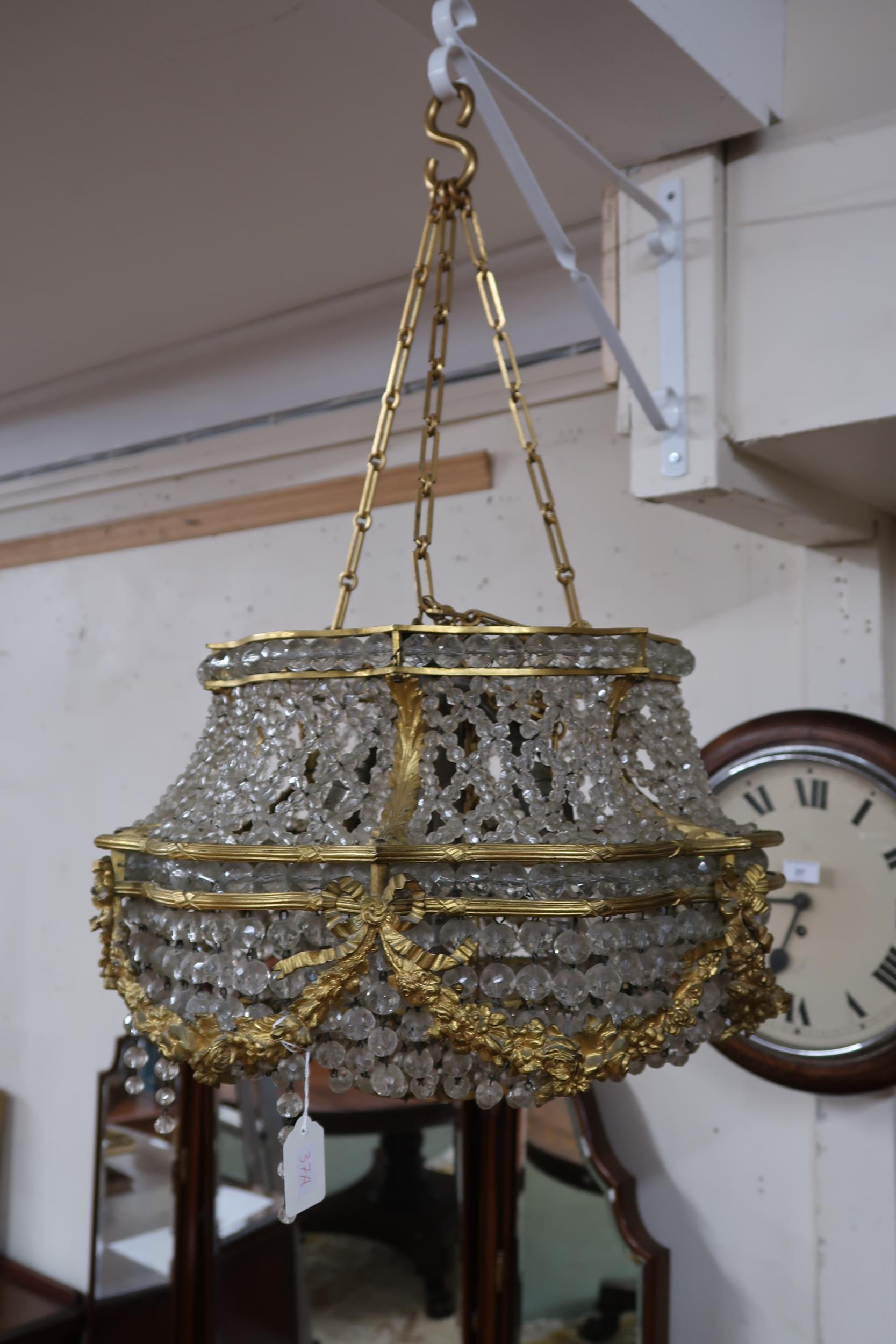 An early 20th century Louis XVI style basket chandelier with cast brass floral swags joined by - Image 2 of 5