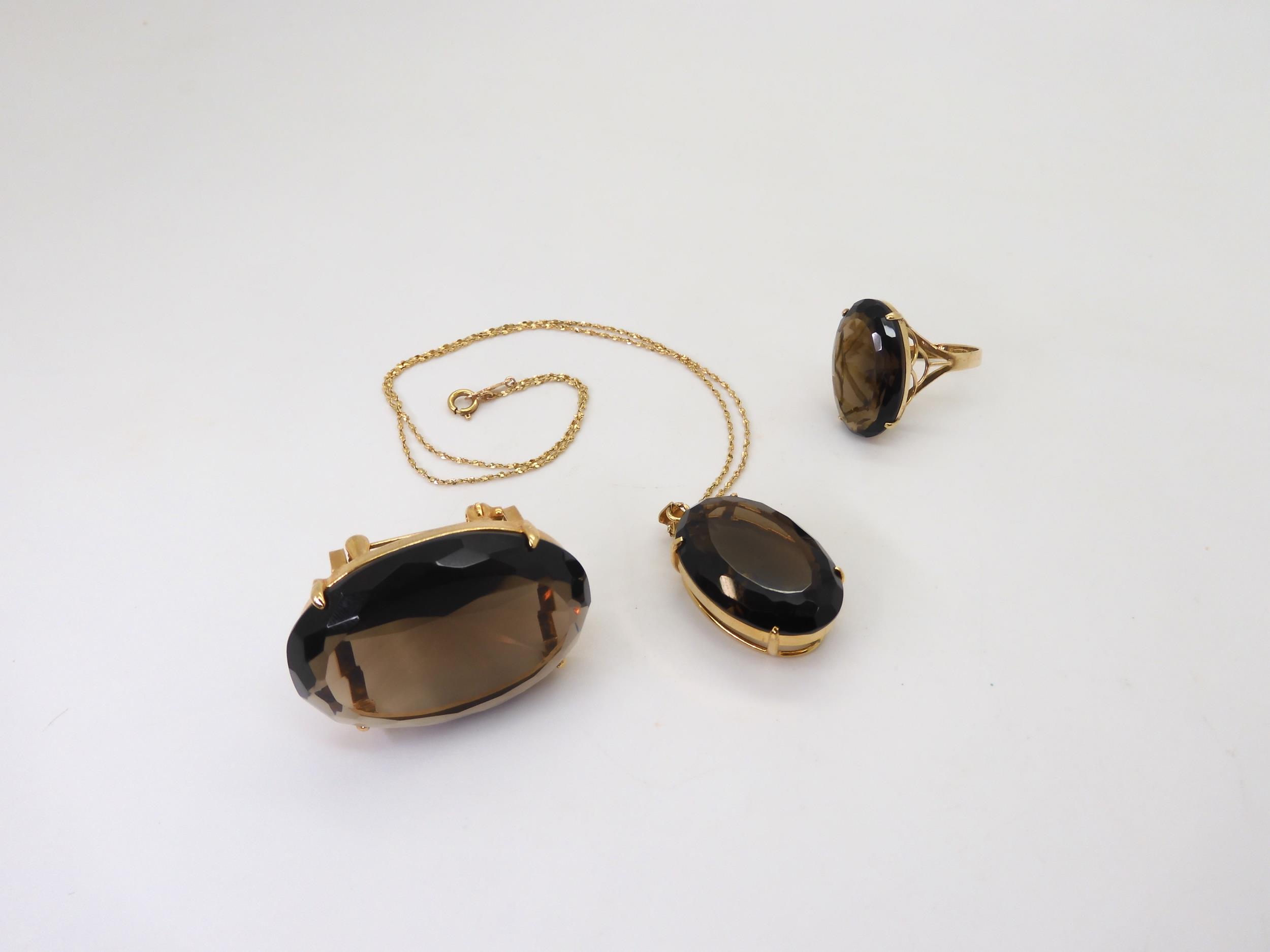 A 14k gold smoky quartz ring, with similar gold plated brooch and pendant, the pendant with a 14k - Image 2 of 5