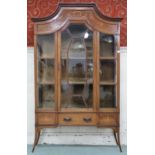 A late Victorian mahogany and satinwood inlaid display cabinet with single central glazed door