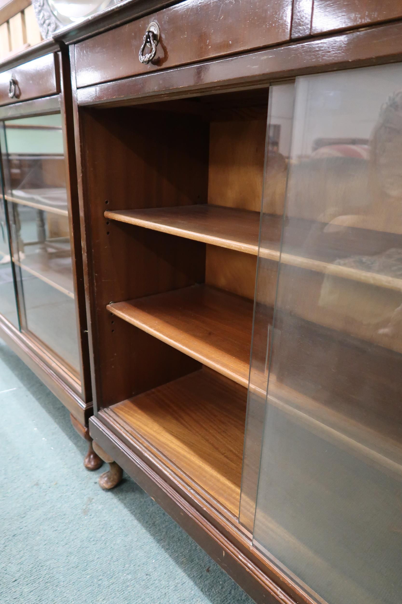 A pair of 20th century stained teak bookcases with pair of drawers over glass sliding doors, 90cm - Image 5 of 6