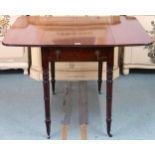 A Victorian mahogany Pembroke table on turned supports terminating in brass casters, 70cm high x