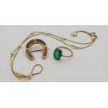 A 9ct gold Scottish agate horseshoe brooch, 2.5cm x 2.3cm, a 9ct and silver mounted green glass