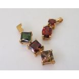 A yellow metal mounted multi gem set pendant, together with a red gem set pendant, weight together