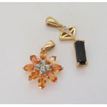 A 9ct gold bi colour orange gem (possibly Andalusite) green gem and diamond accent flower pendant,