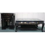 A 20th century Oriental style black lacquered nest of four tables with carved figures under glass