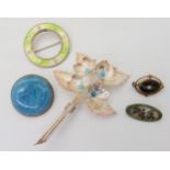 A collection of Charles Horner brooches to include a turquoise glazed ceramic plaque brooch, Chester