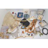 A collection of compacts, and costume jewellery to include an elegant silver cigarette holder, a