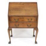 A 20th century mahogany fall front writing bureau on ball and claw supports, 99cm high x 70cm wide x