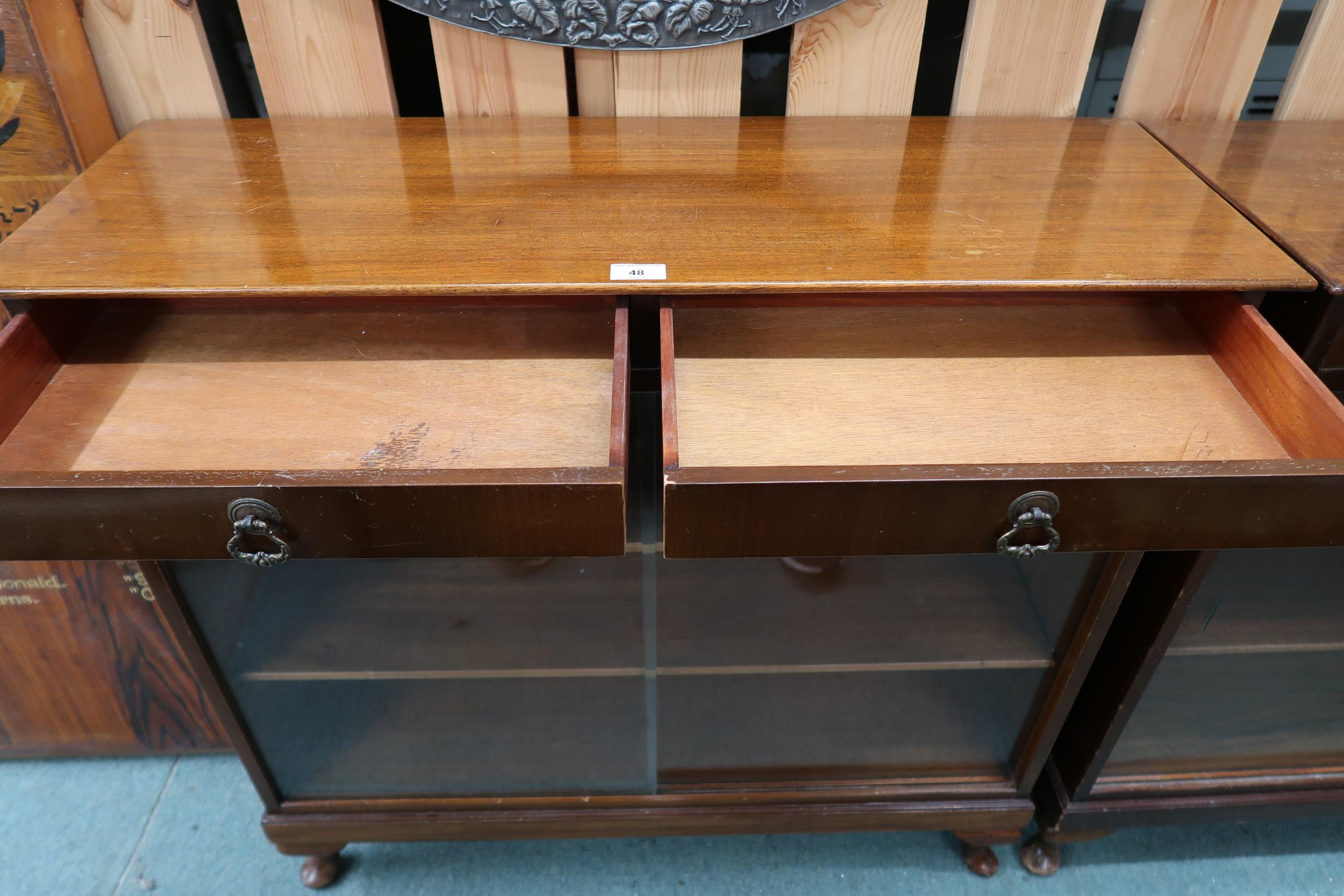 A pair of 20th century stained teak bookcases with pair of drawers over glass sliding doors, 90cm - Image 4 of 6