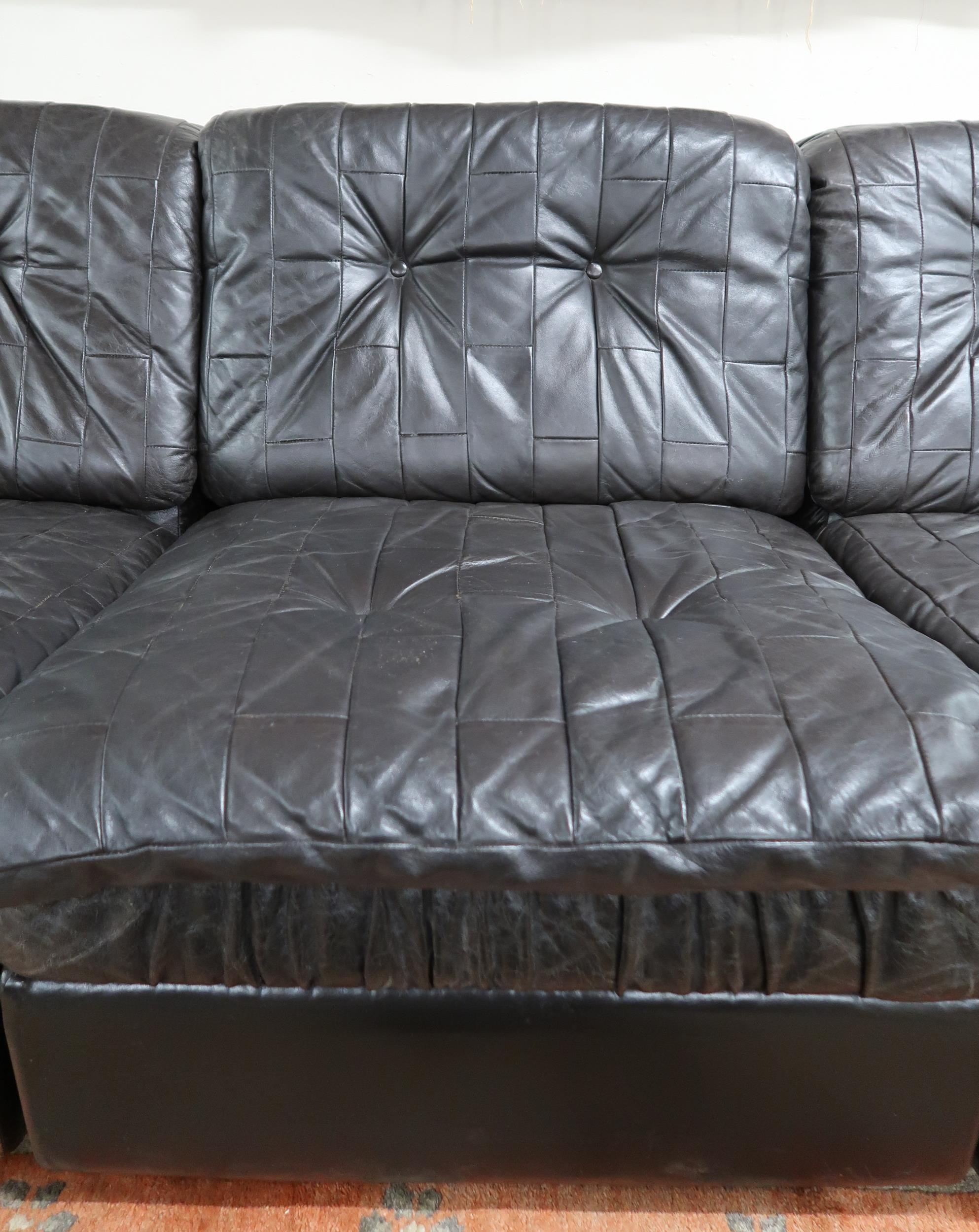A mid 20th century after Tetrad sectional three seater sofa with black patchwork leather upholstery, - Image 3 of 4