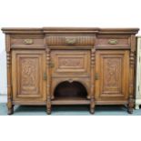 A Victorian oak sideboard with three drawers over three cabinet doors, 98cm high x 150cm wide x 51cm