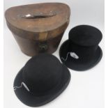 A silk top hat by Battersby & Co., London, small size, measuring approx. 20cm front-to-back and 15.