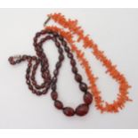 A string of cherry amber coloured beads, weight 32.1gms, largest bead approx 21.5mm x 16.4mm and a
