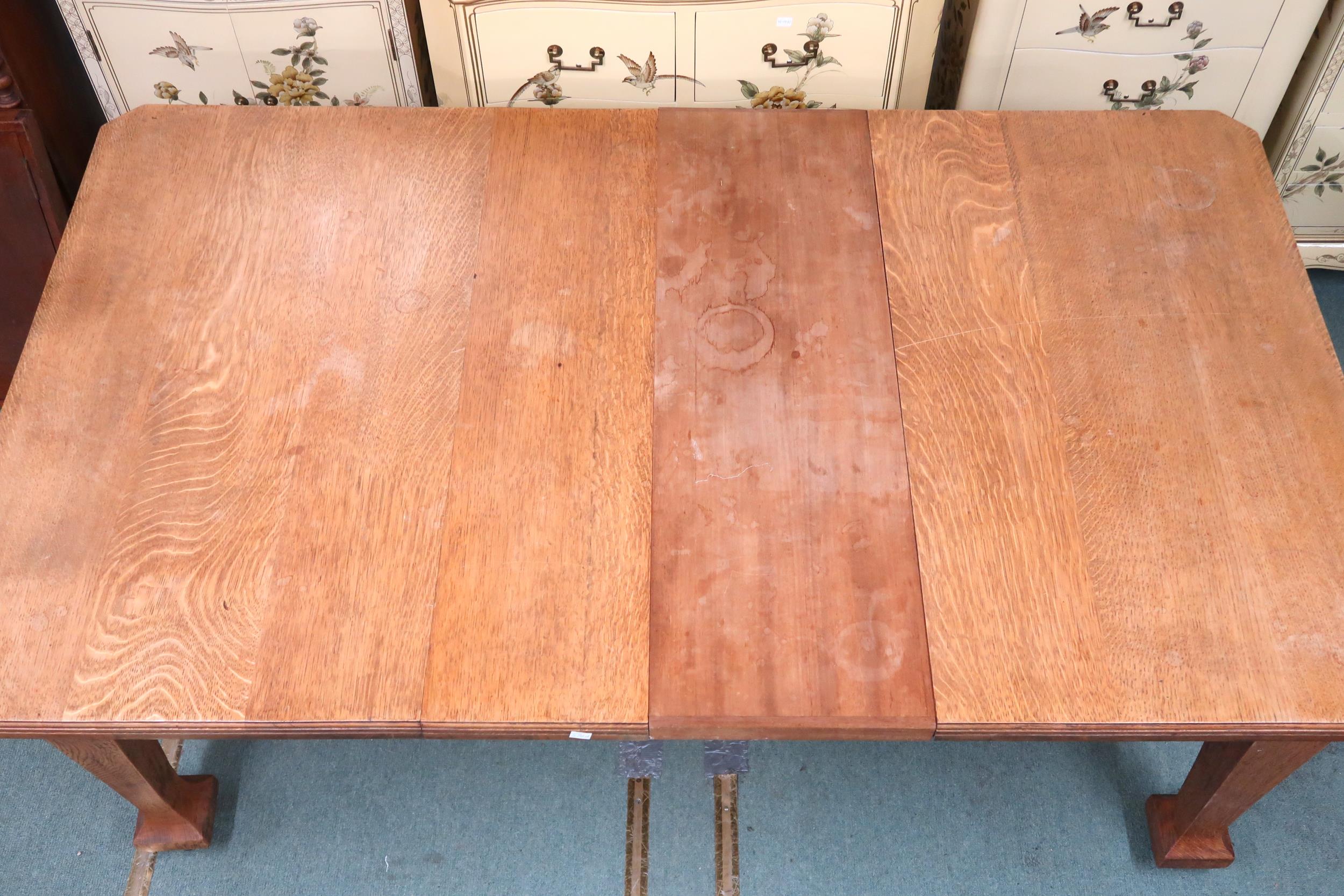 A late Victorian oak arts and crafts style wind out extending dining table with two leaves (one - Image 6 of 9