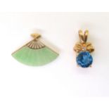 A 9ct gold Chinese green hardstone fan pendant, together with a blue and clear gem set pendant,