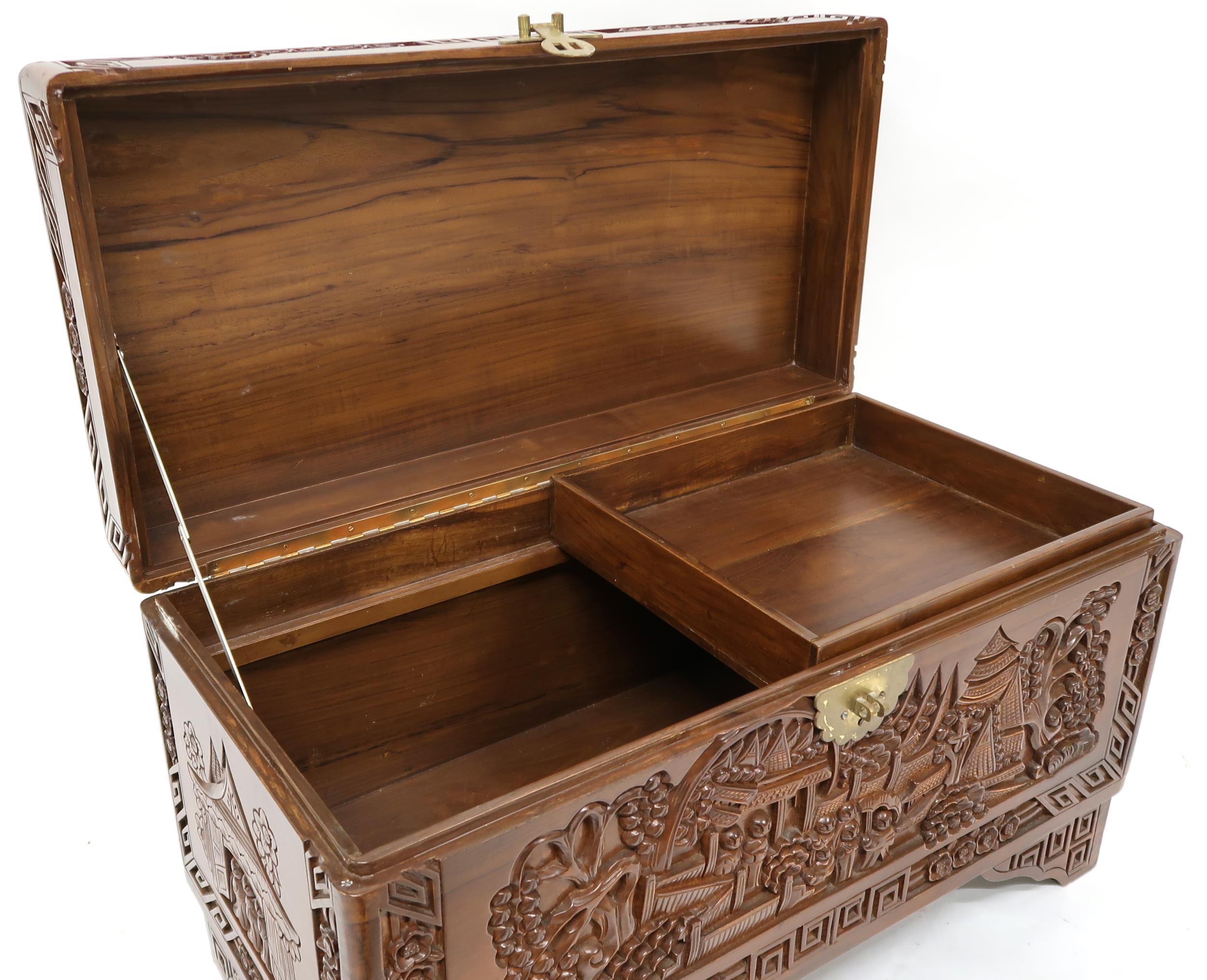 A 20th century carved Oriental hardwood blanket chest with internal sliding tray, 47cm high x 79cm - Image 4 of 5