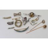A yellow metal pearl set horseshoe pin, weight 2.1gms, together with other items of silver and