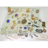 A collection of vintage costume brooches, silver and white metal jewellery to include a Pontin's