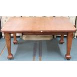 A late Victorian oak arts and crafts style wind out extending dining table with two leaves (one