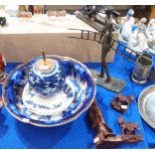 A sculpture of a window cleaner, a flow bleu washbowl, a ginger jar table lamp, carved wooden figure