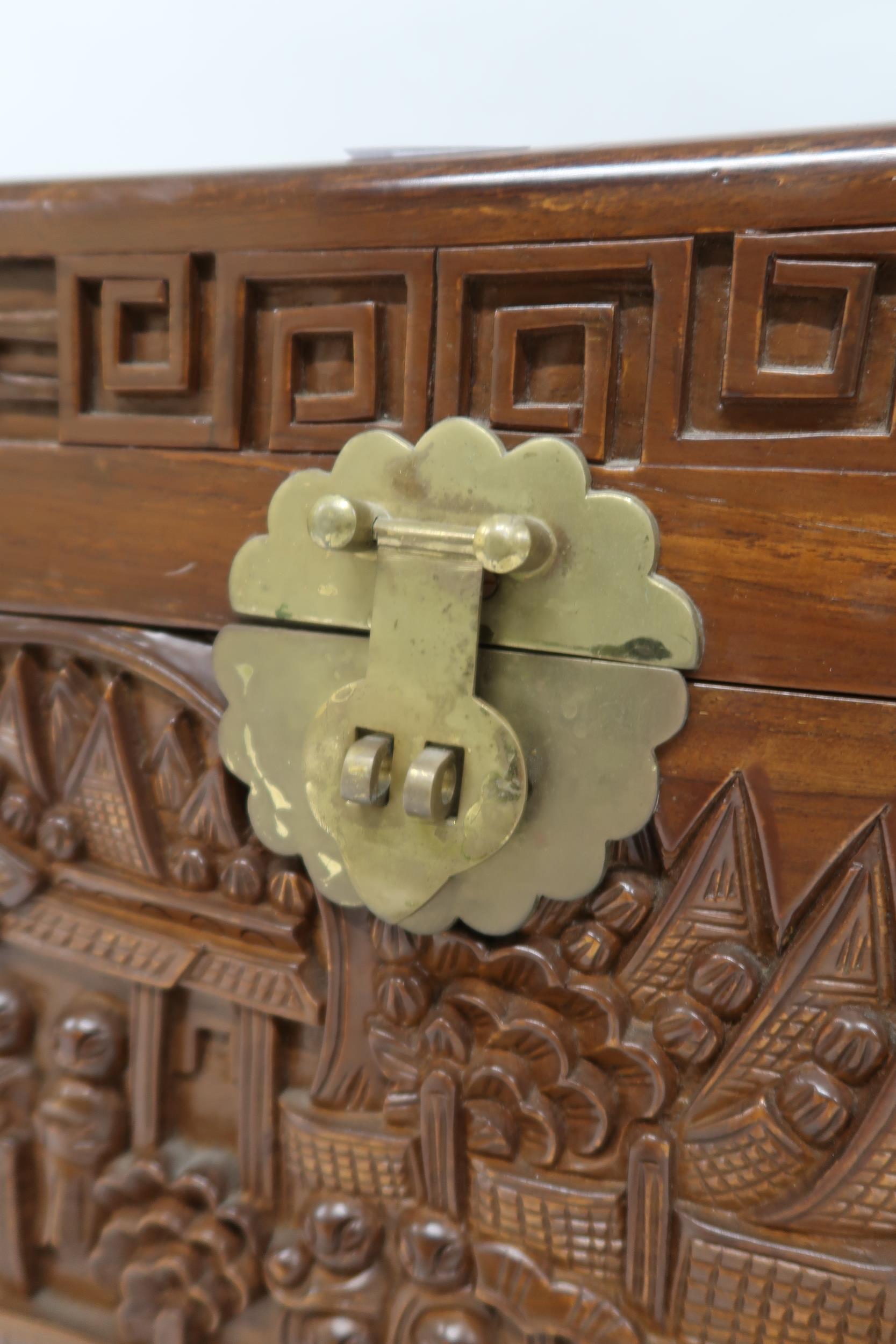 A 20th century carved Oriental hardwood blanket chest with internal sliding tray, 47cm high x 79cm - Image 2 of 5