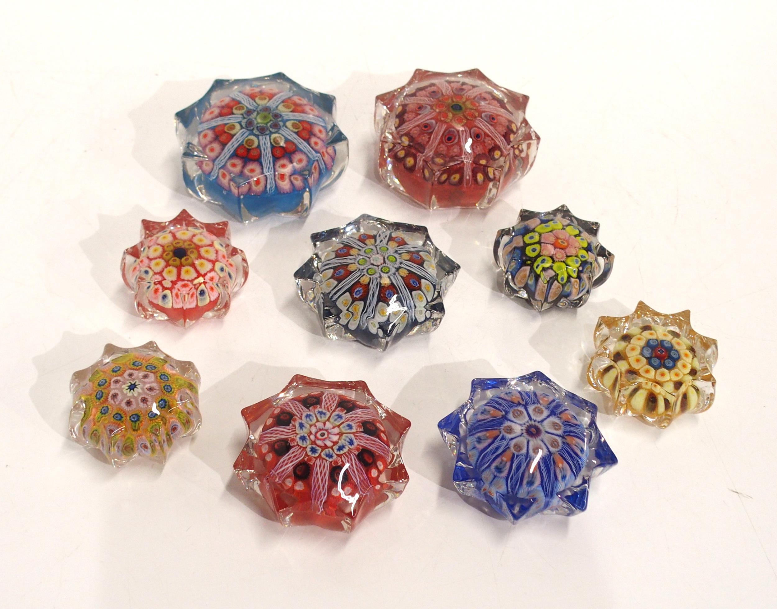 Nine Strathearn style star shaped millefiori glass paperweights of varying sizes Condition Report:No