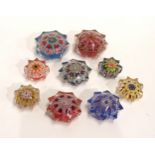 Nine Strathearn style star shaped millefiori glass paperweights of varying sizes Condition Report:No