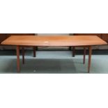 A mid 20th century teak Gordon Russell Broadway Worcs coffee table with shaped rectangular top on