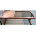 A mid 20th century teak framed G Plan tile and glass topped coffee table, 44cm high x 121cm long x