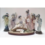 A Lladro group Springtime in Japan, modelled as two geishas on a bridge together with four other