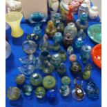 A large collection of Mdina glass items to include paperweights, vases, dishes etc Condition