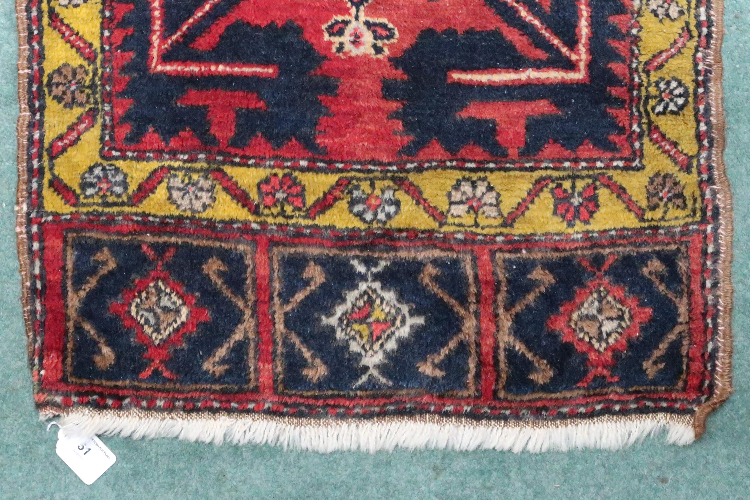 A pink ground Persian rug with cream central medallion, dark blue spandrels and mustard border, - Image 2 of 4