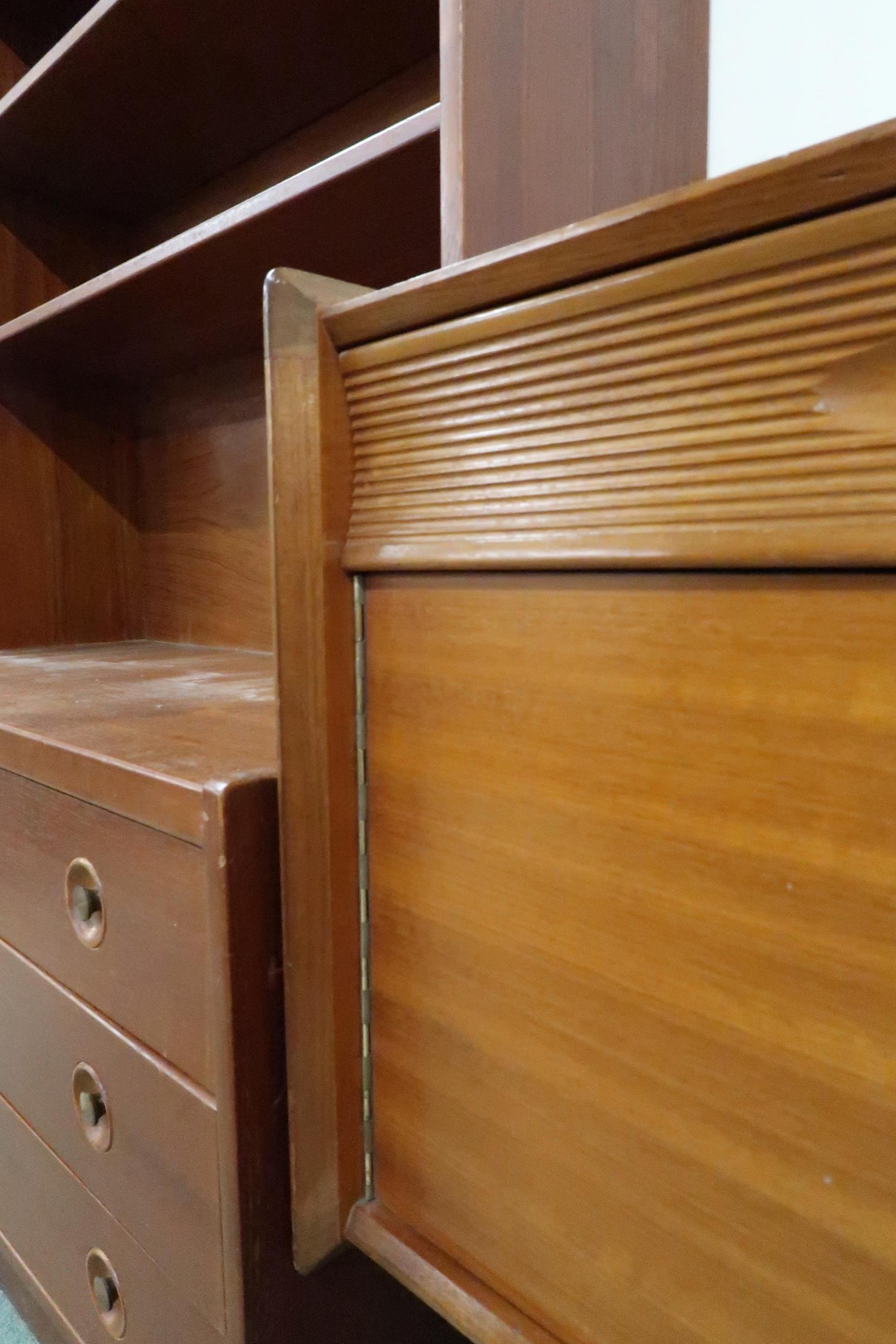 A mid 20th century teak sideboard with three drawers over central fall front compartment flanked - Image 7 of 8