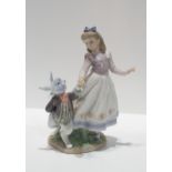 A Lladro figure of Alice in Wonderland, sculpted by Jose Luis Alvarez Condition Report:No