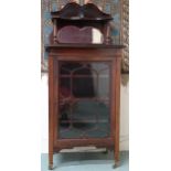 A late Victorian mahogany peer cabinet with shelved mirrored superstructure over glazed door