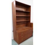 A mid 20th century teak open bookcase with three shelves over three drawers, 166cm high x 92cm