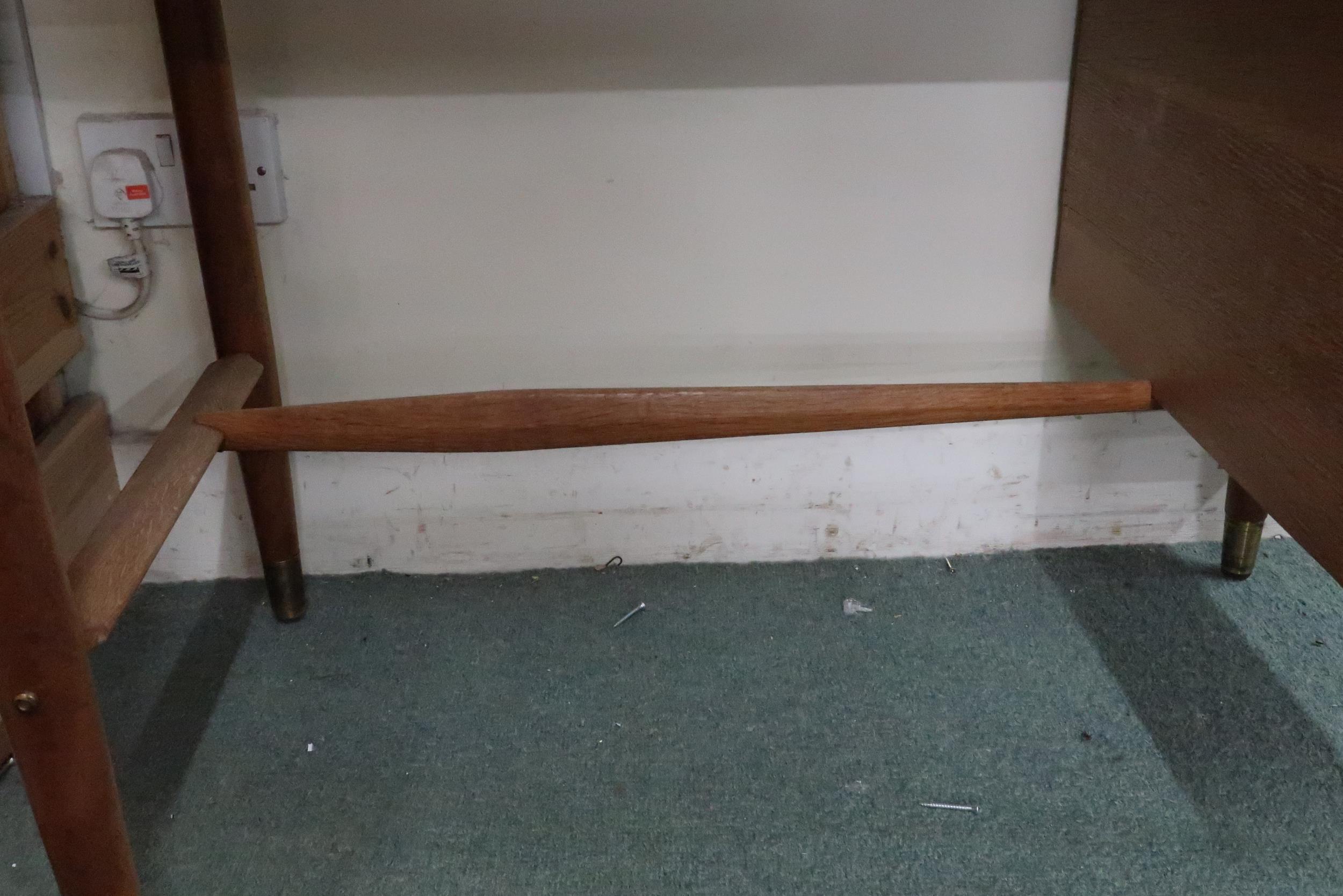 A mid 20th century teak desk with red vinyl skiver over bank of three drawers on tapering - Image 4 of 6