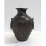 An Anglo-Roman style lead cinerary urn, with loop detailing to the sides, 26cm high Condition Repor
