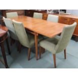 A mid 20th century teak McIntosh extending dining table and six chairs, dining table with