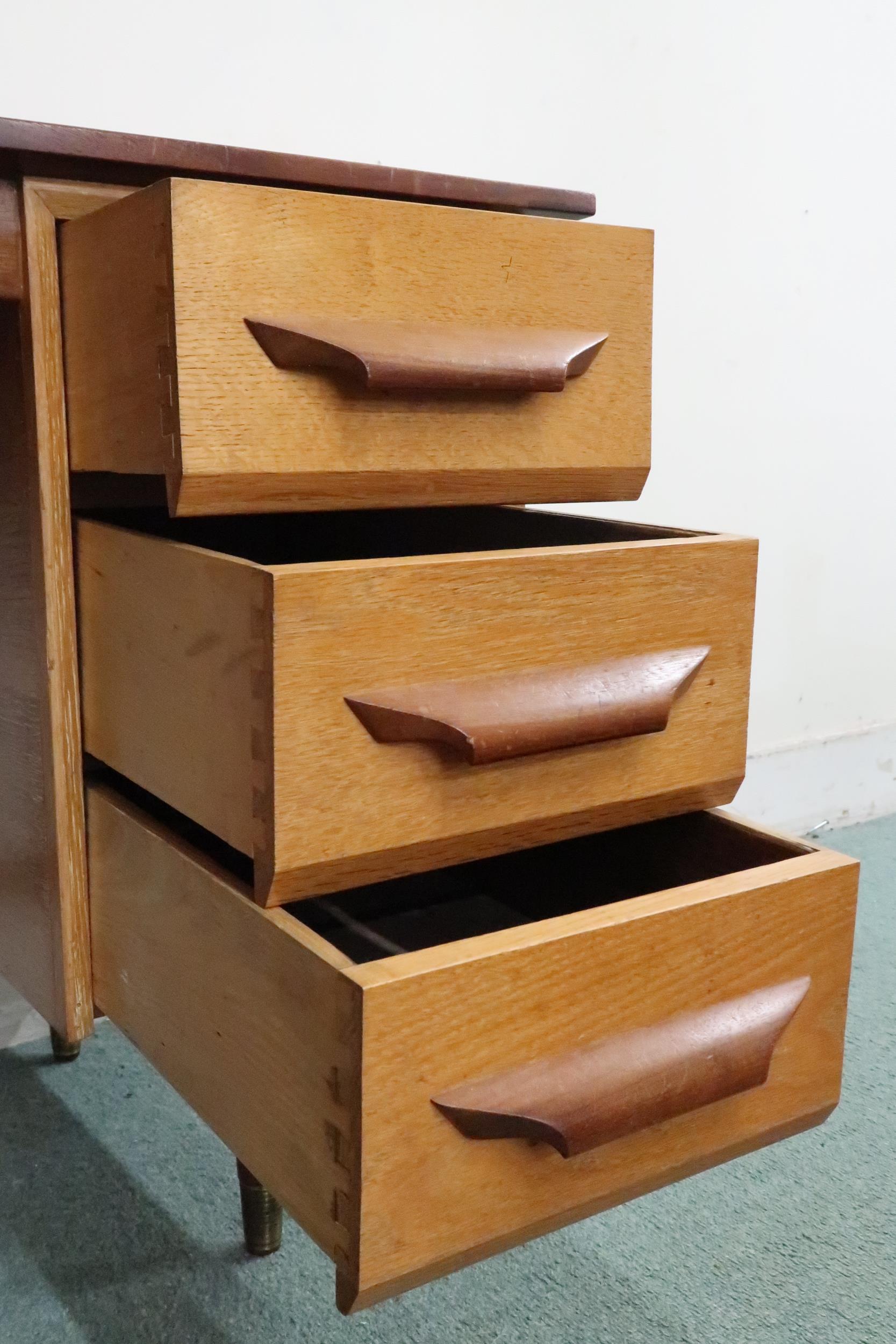 A mid 20th century teak desk with red vinyl skiver over bank of three drawers on tapering - Image 3 of 6