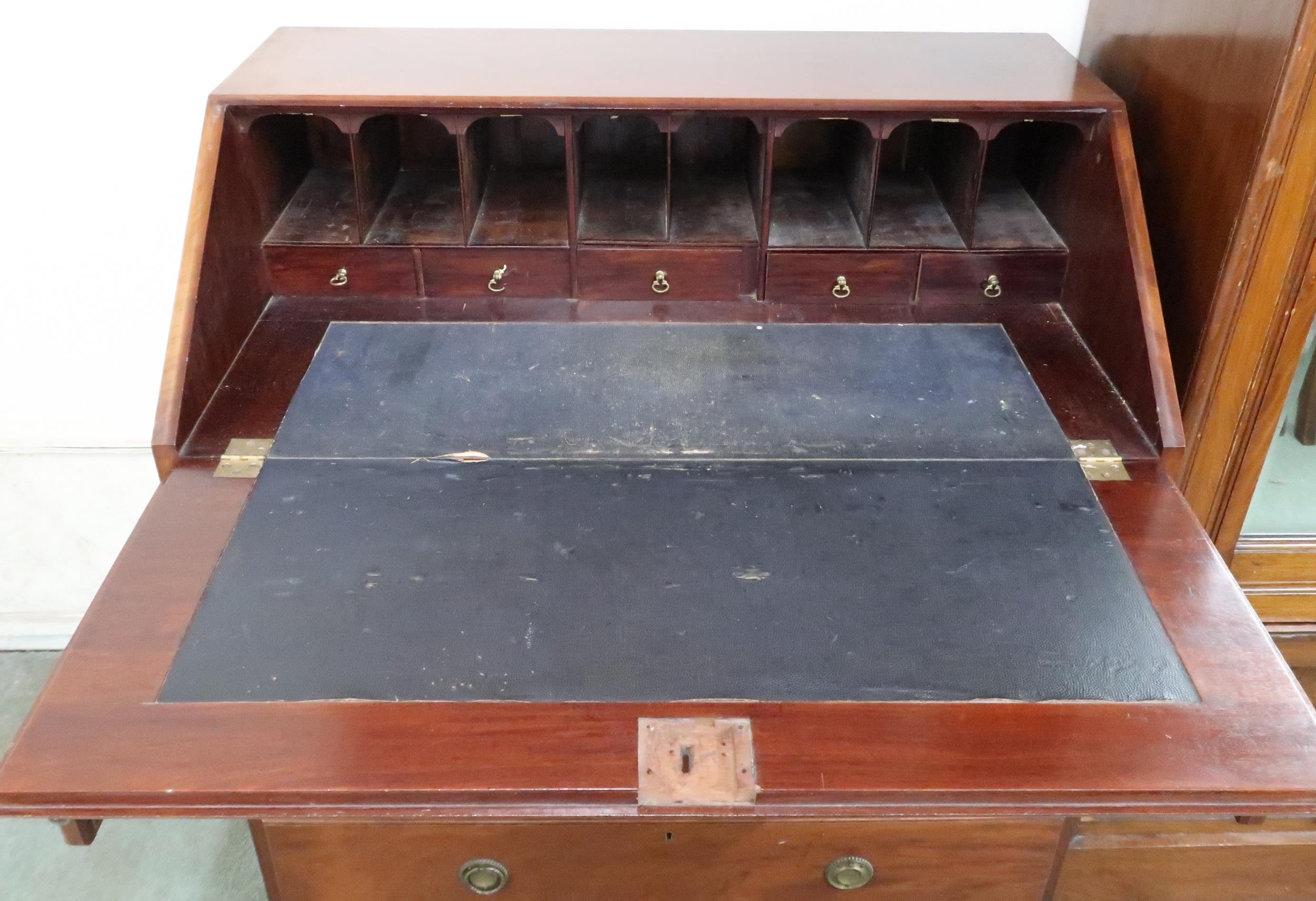 An early 20th century mahogany bureau with fitted fall front writing compartment over two short over - Image 5 of 6