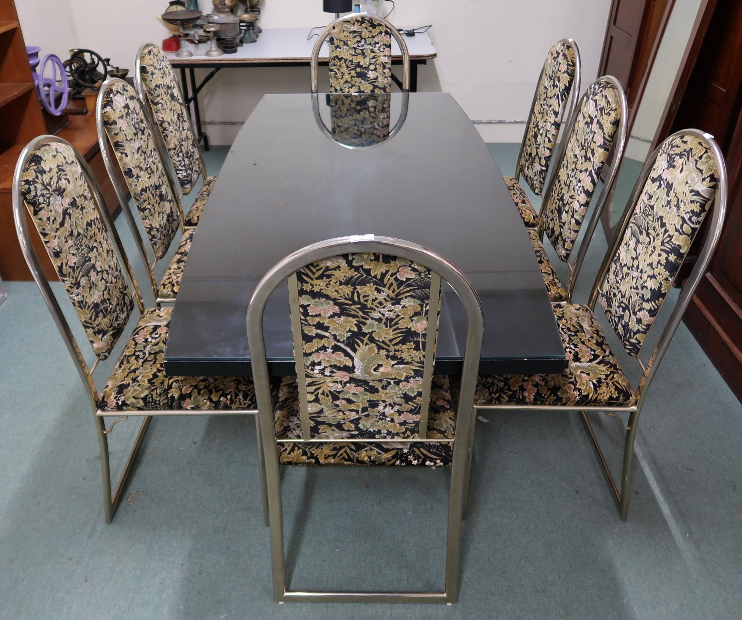 A late 20th century black lacquer and gilt brass Bellagio style dining table, 74cm high x 185cm long